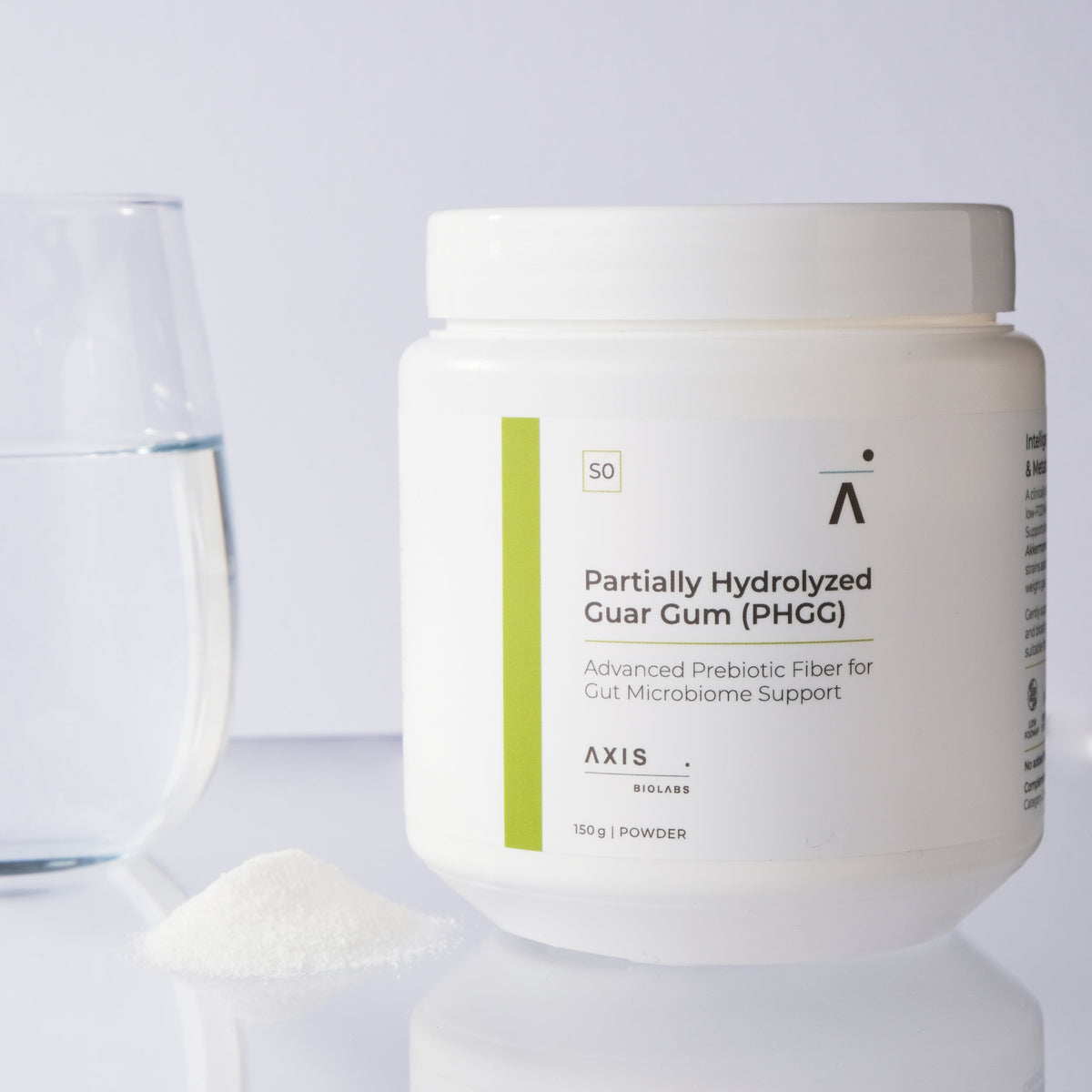 A white plastic jar of AXIS BioLabs Partially Hydrolyzed Guar Gum (PHGG) powder, shown on a reflective white surface with a glass of water and a small pile of the prebiotic powder on the left.